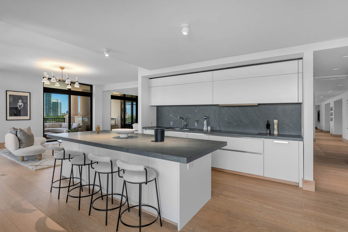 The condo’s kitchen includes high-end fixtures from brands like Gaggenau.